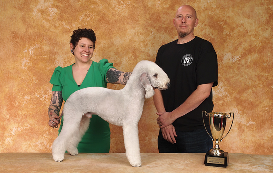 Nadia Bongelli with a white poodle and the Nature's Specialties Sponsor