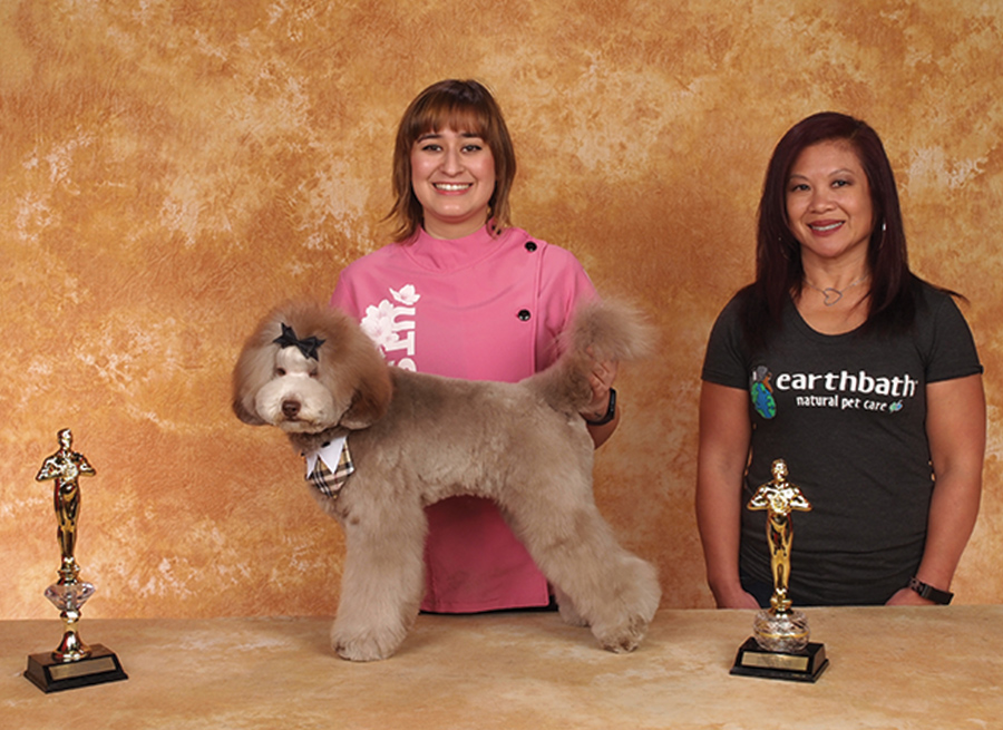 Alyssa Ortega with a brown fluffy dog and the Earthbath Sponser