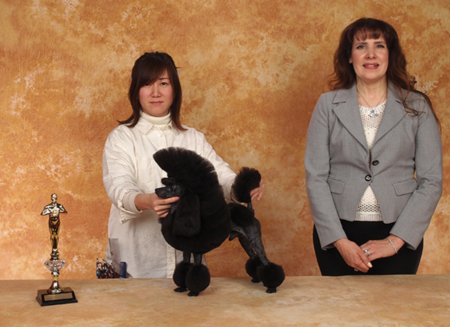 Shiho Nakamura with a small poodle and the Wag'n Tails  sponsor