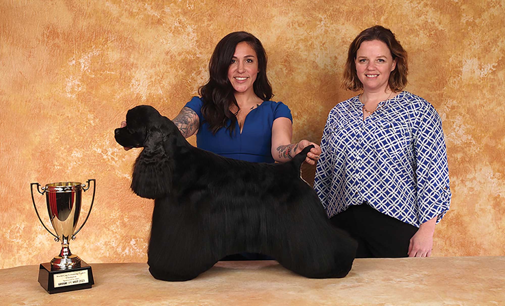 Mackensie Murphy with sponsor AKC and a black dog