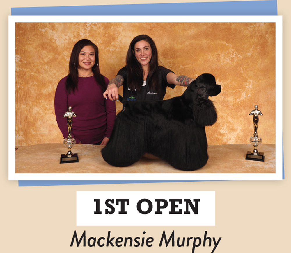 Mackensie Murphy posing with a dog and a trophy