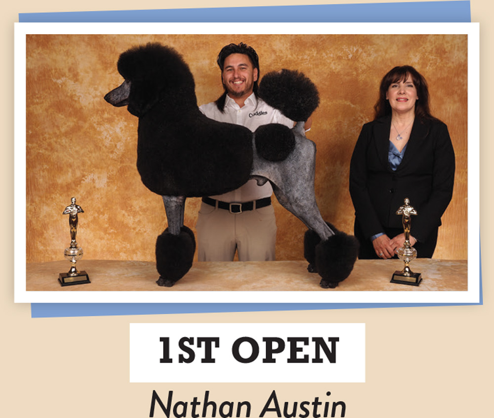 Nathan Austin posing with a dog and a trophy