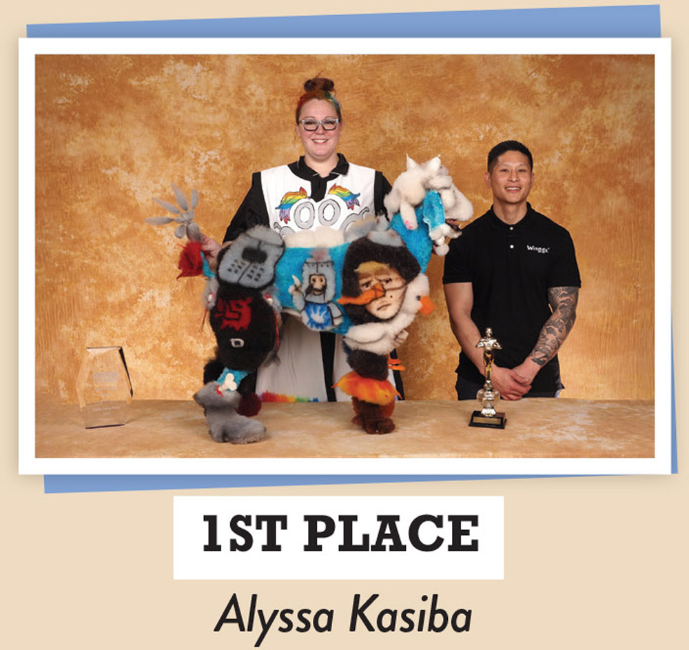 Alyssa Kasiba posing with a dog and a trophy