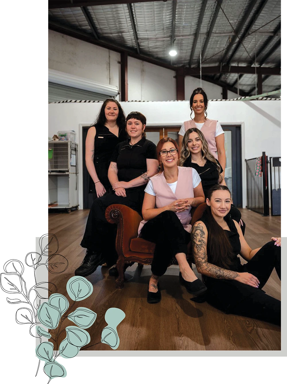 team of groomers taking a group photo