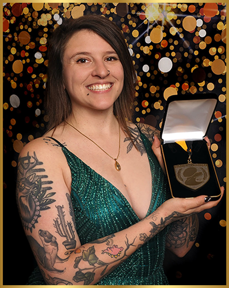 Nadia Bongelli pictured holding a medal in a presentation box
