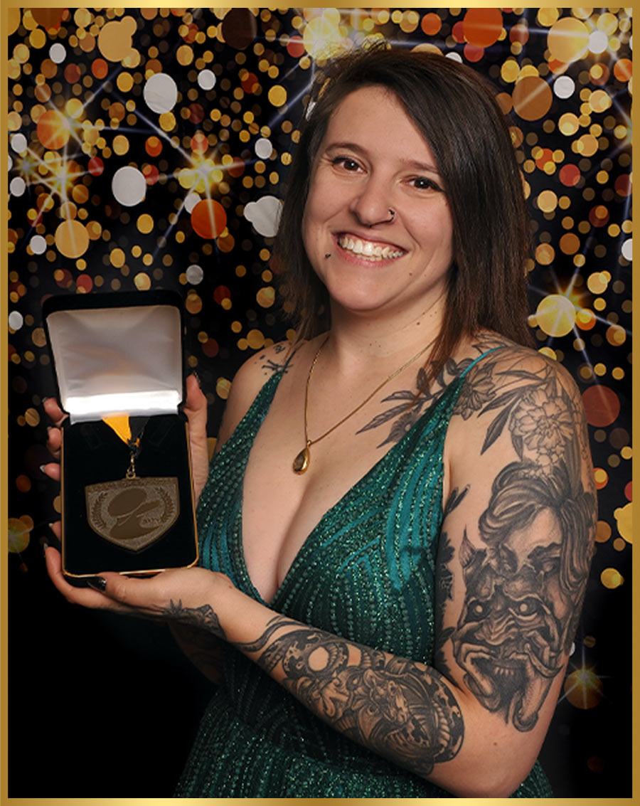 Nadia Bongelli pictured holding a medal in a presentation box