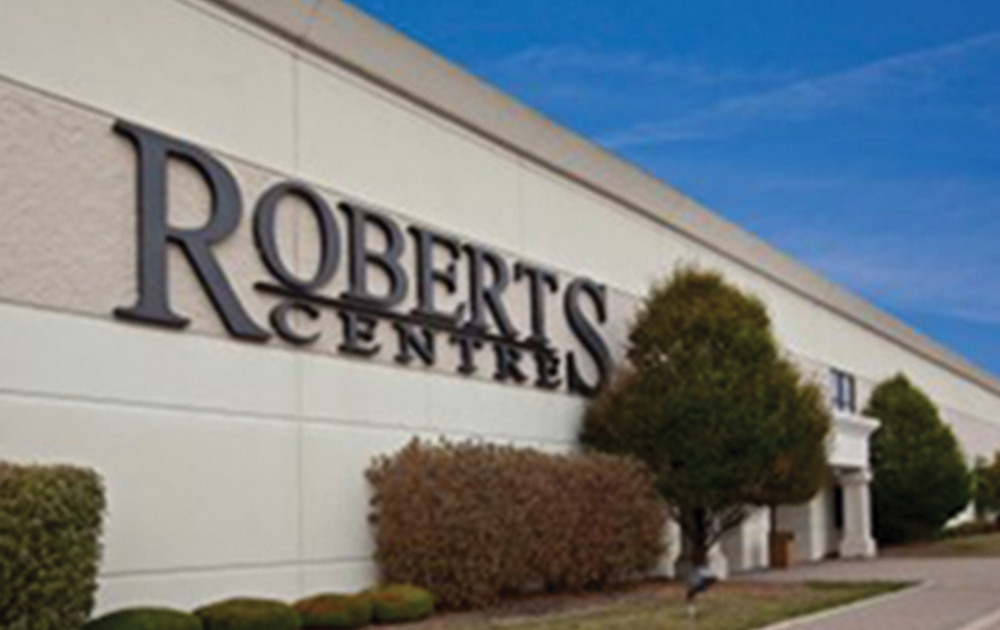 angled front view of the Roberts Centre with a focus on the building signage